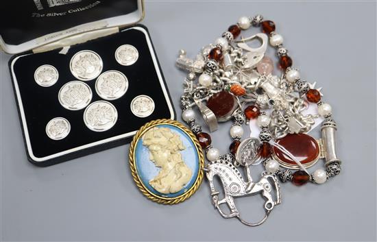 A silver charm bracelet and other jewellery including costume.